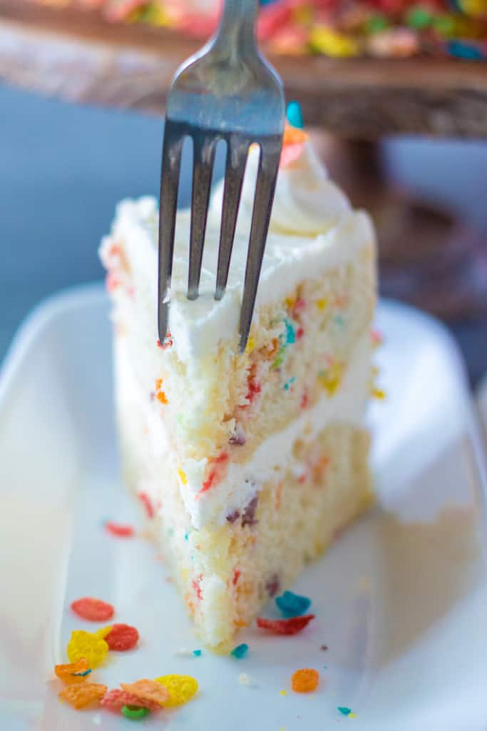 one slice of Fruity Pebbles cake with a fork