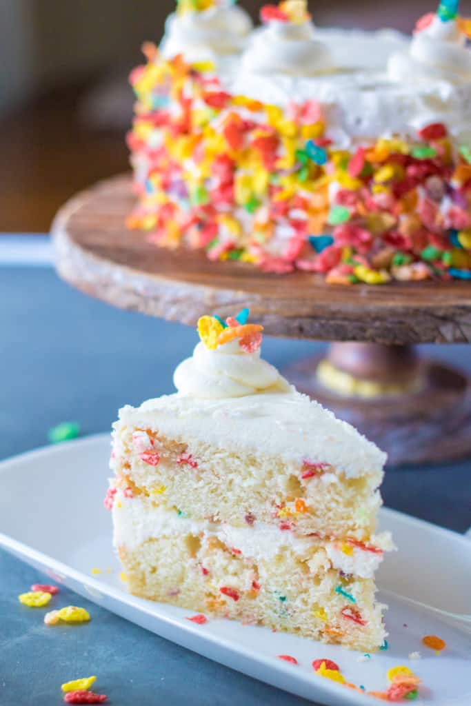 one slice of Fruity Pebbles layer cake