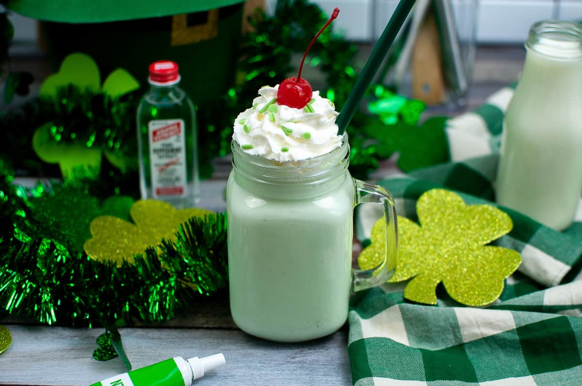 finish the Shamrock shake with whipped cream, a cherry, and sprinkles