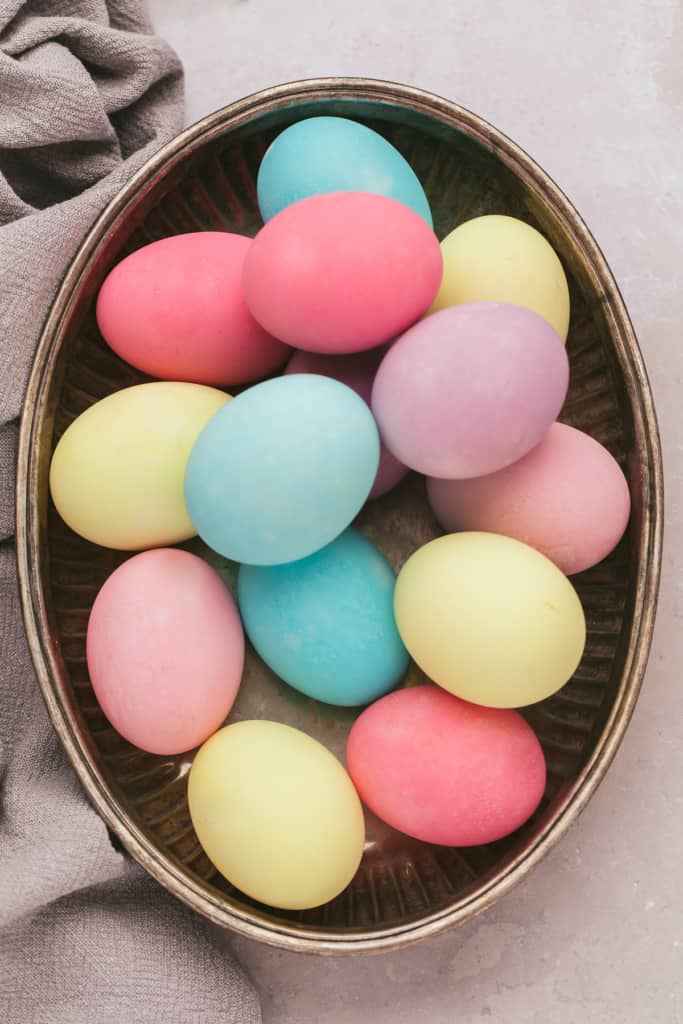 a bowl with dyed Easter eggs