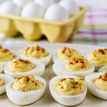 deviled eggs on a white platter