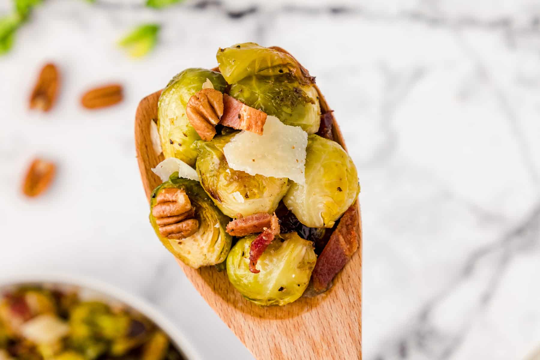 a spoonful of roasted brussels sprouts with bacon