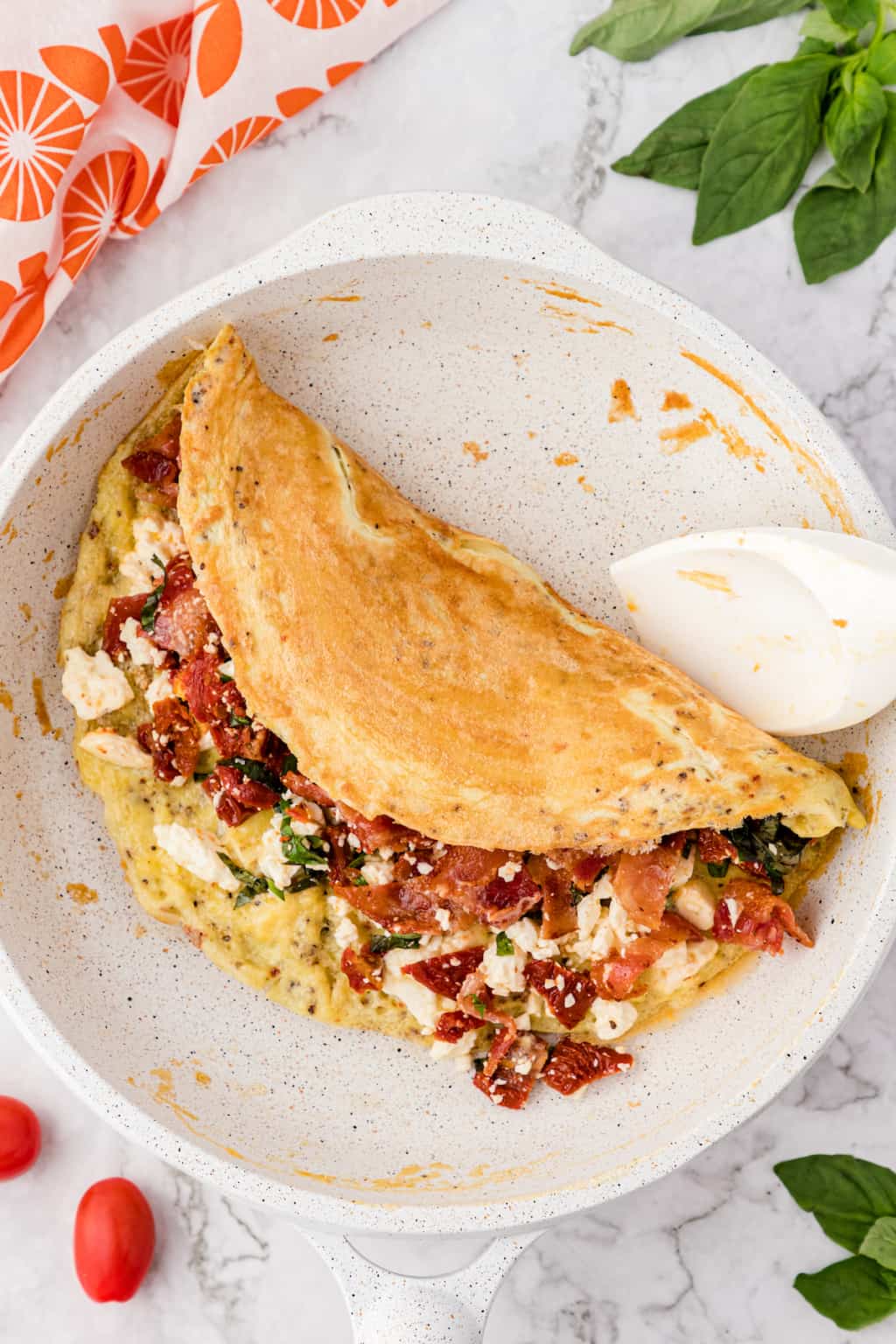 The Best Bacon Omelet Recipe with SunDried Tomato and Feta Cheese