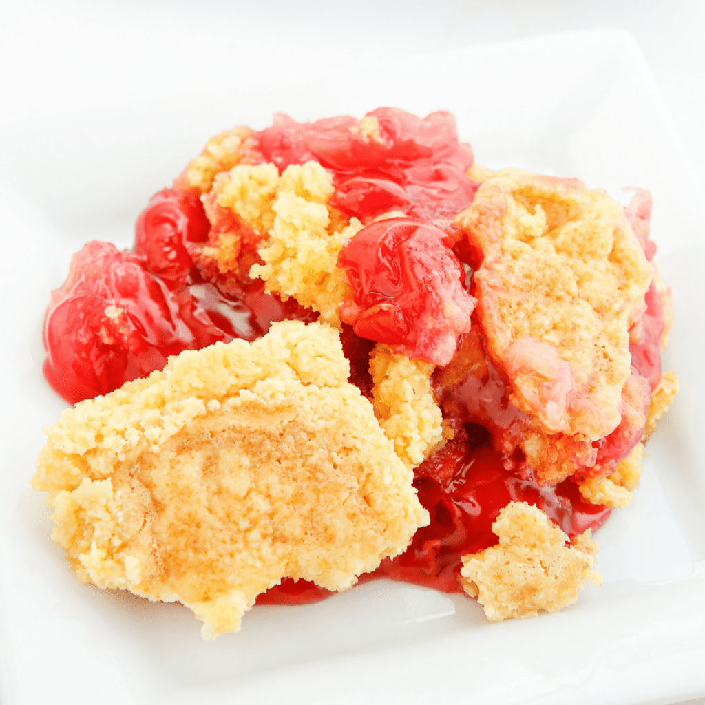 cherry pineapple dump cake on a plate