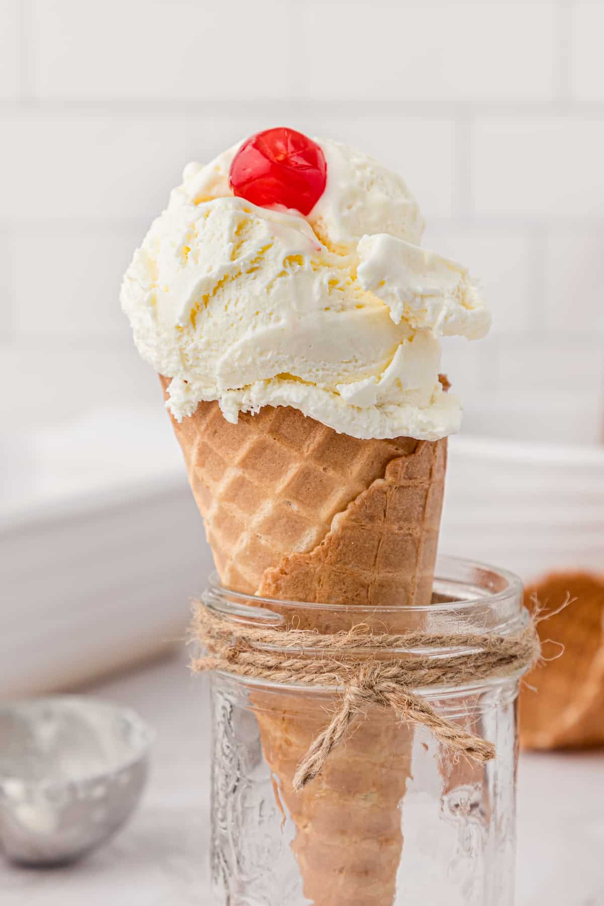 an ice cream cone with vanilla ice cream