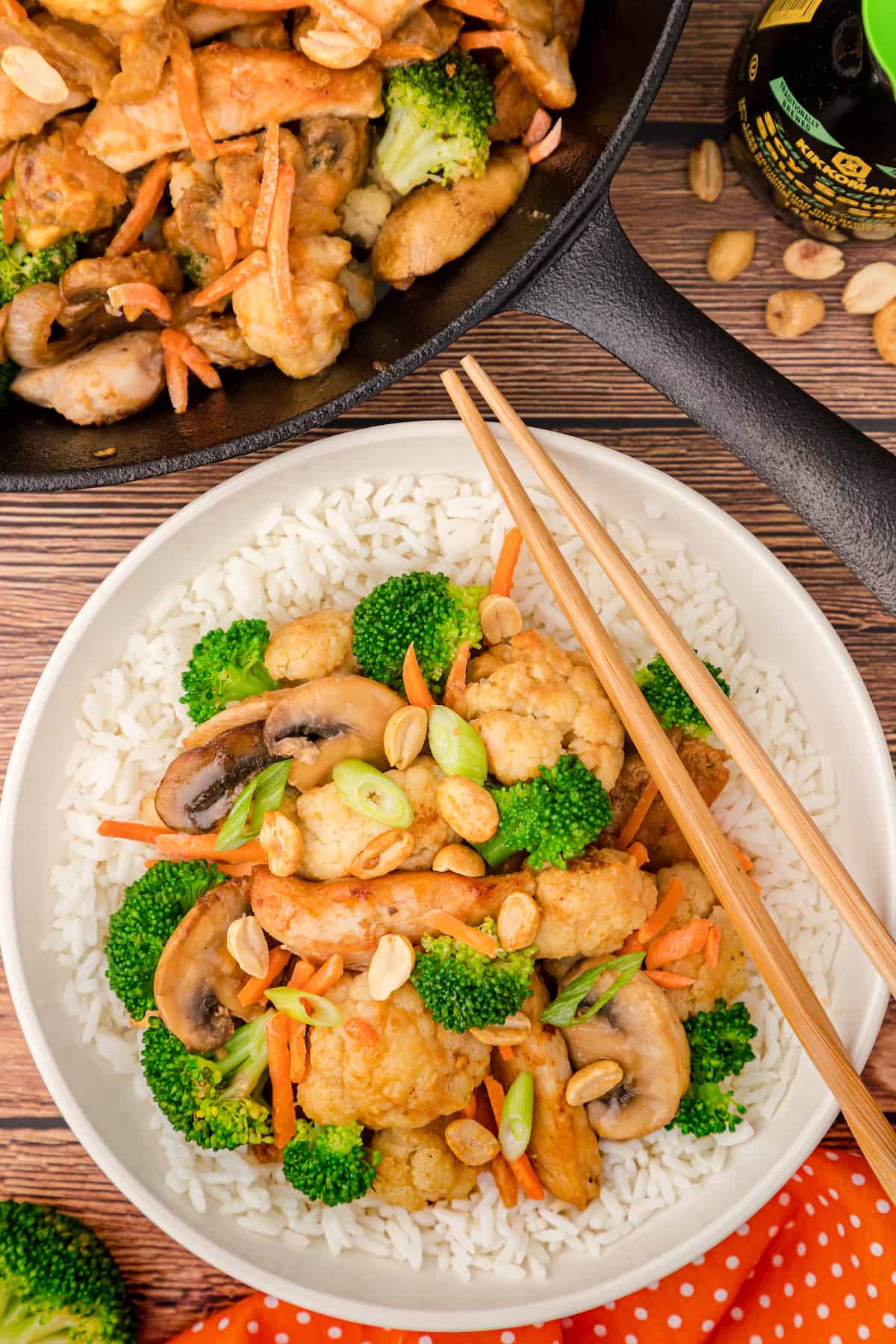 a plate with peanut stir fry over rice