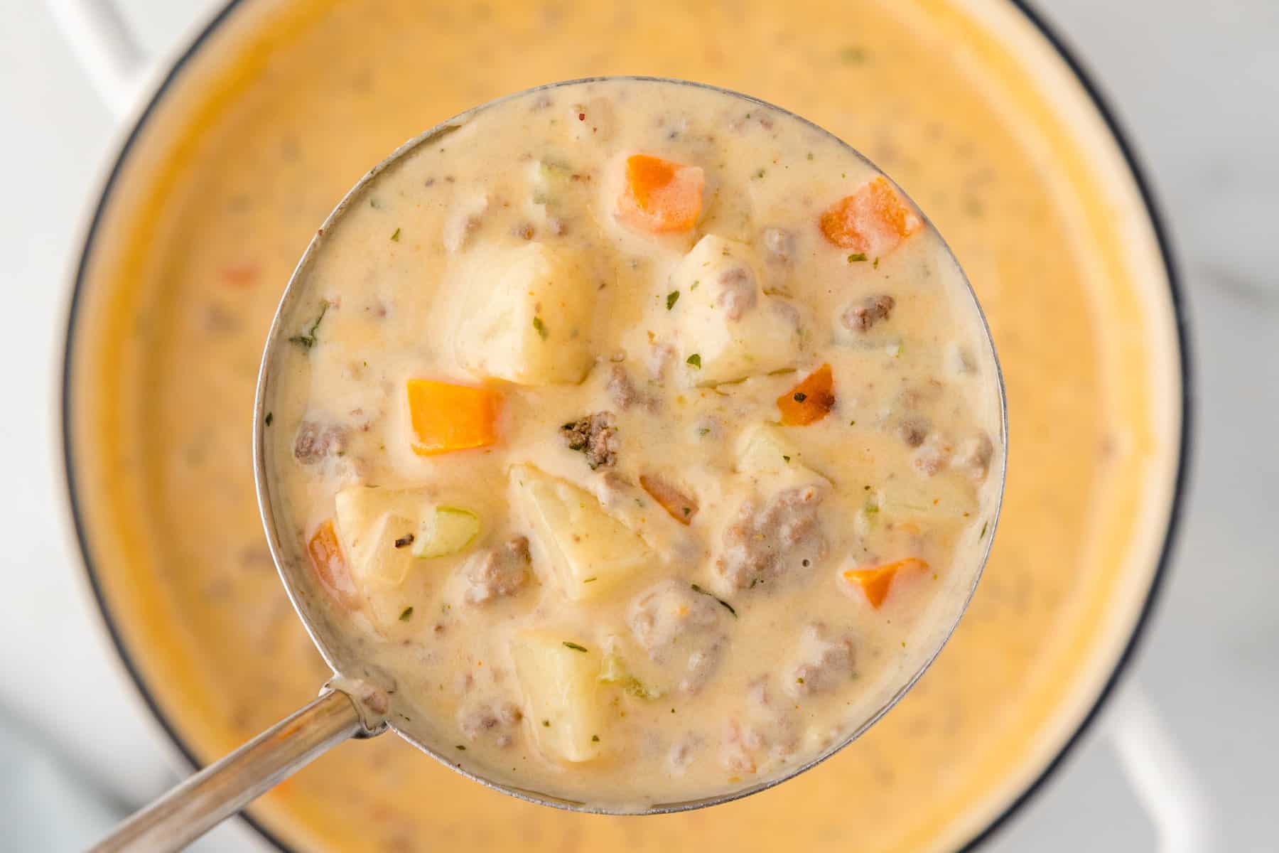 a ladle full of cheeseburger soup