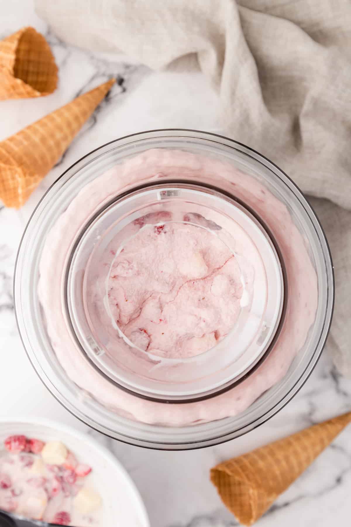 ice cream maker churning strawberry cheesecake ice cream