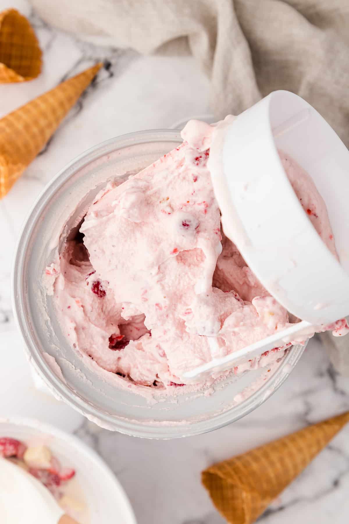 strawberry cheesecake ice cream after churning in the ice cream maker