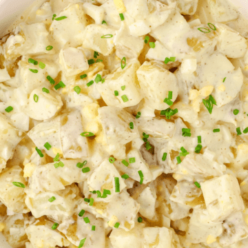 a close up of Instant Pot potato salad topped with chives