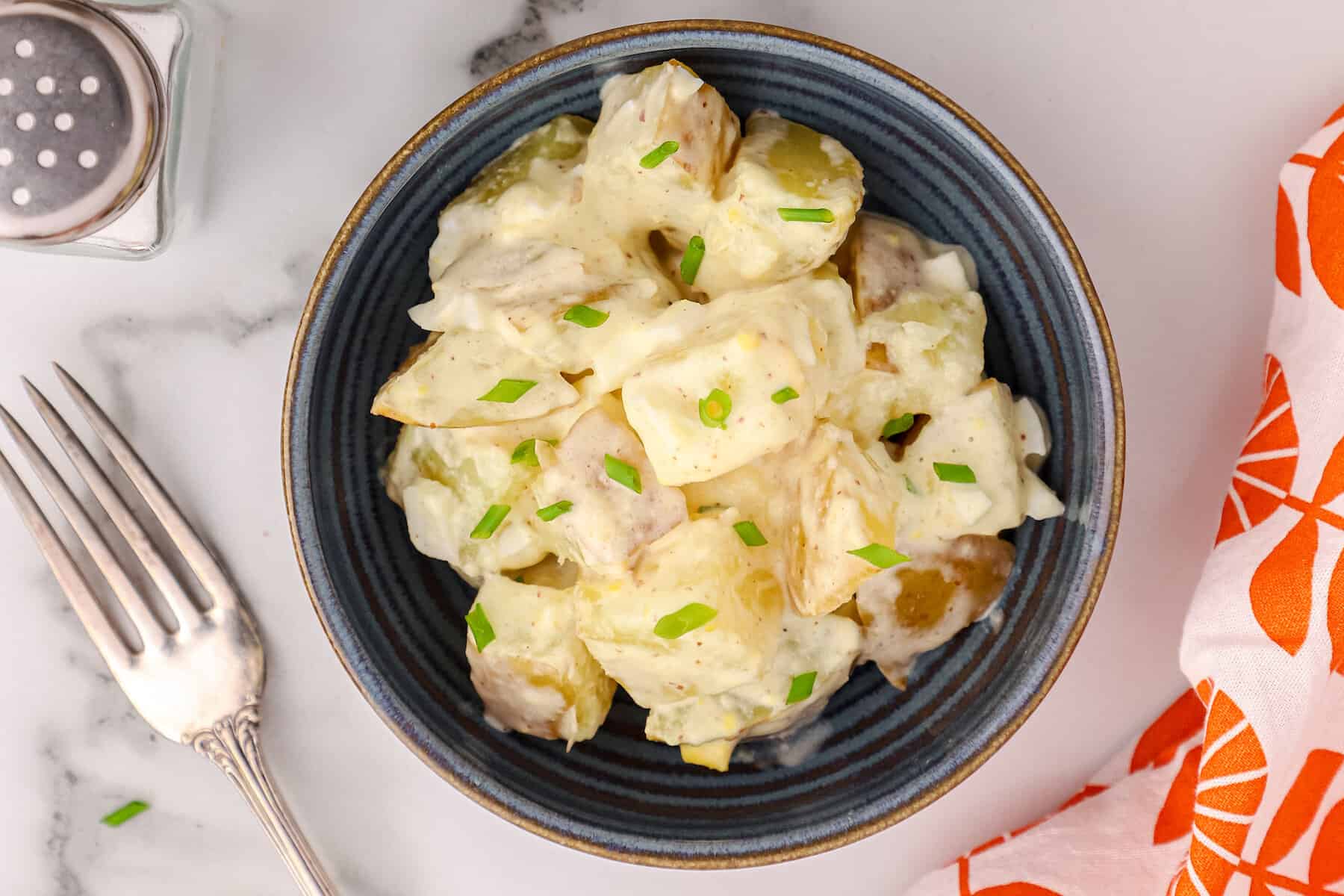 a black bowl with Instant Pot potato salad