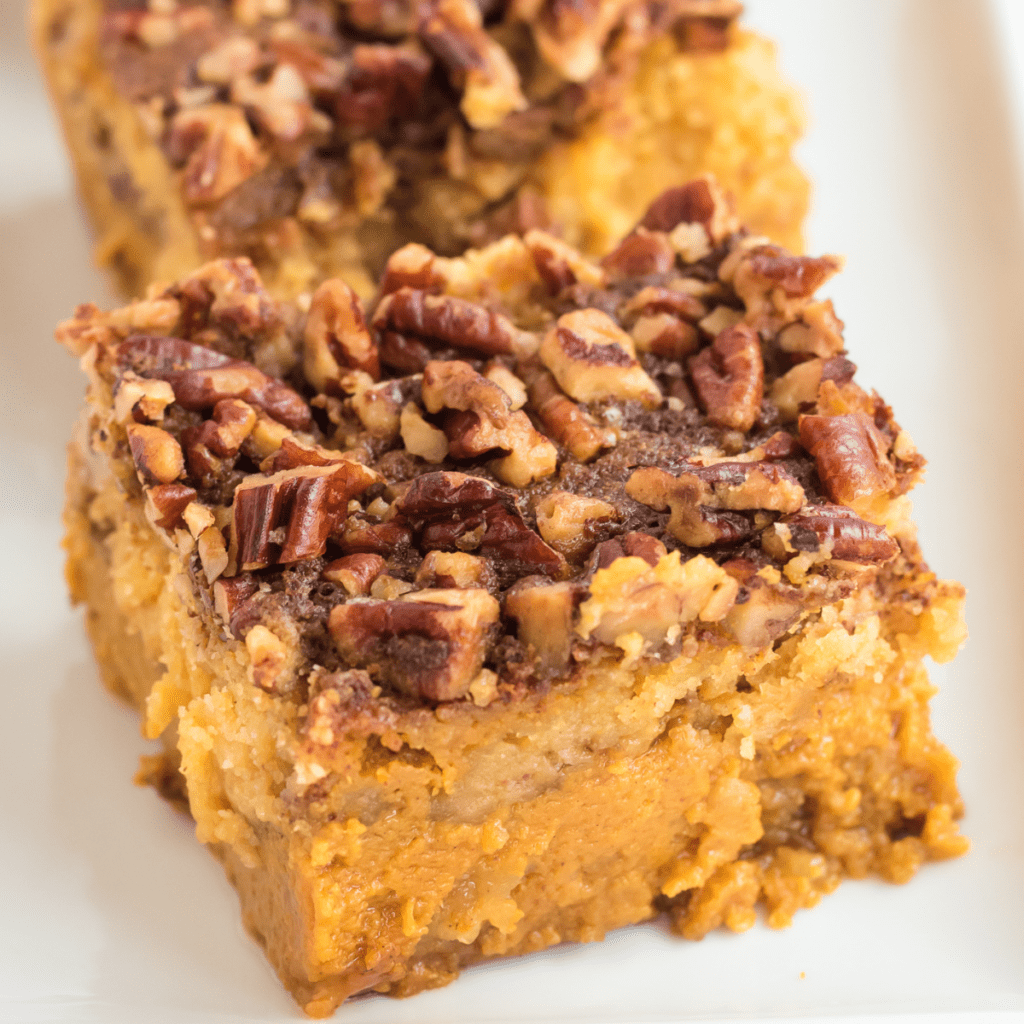 one slice of pumpkin dump cake with roasted pecans