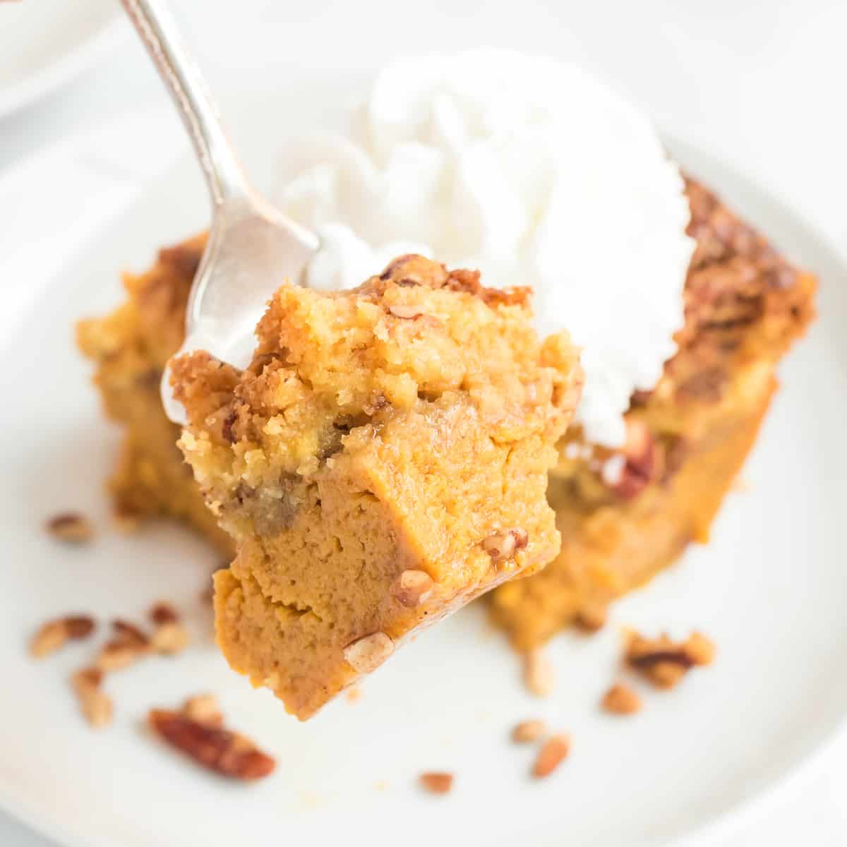 one bite of pumpkin dump cake on a fork