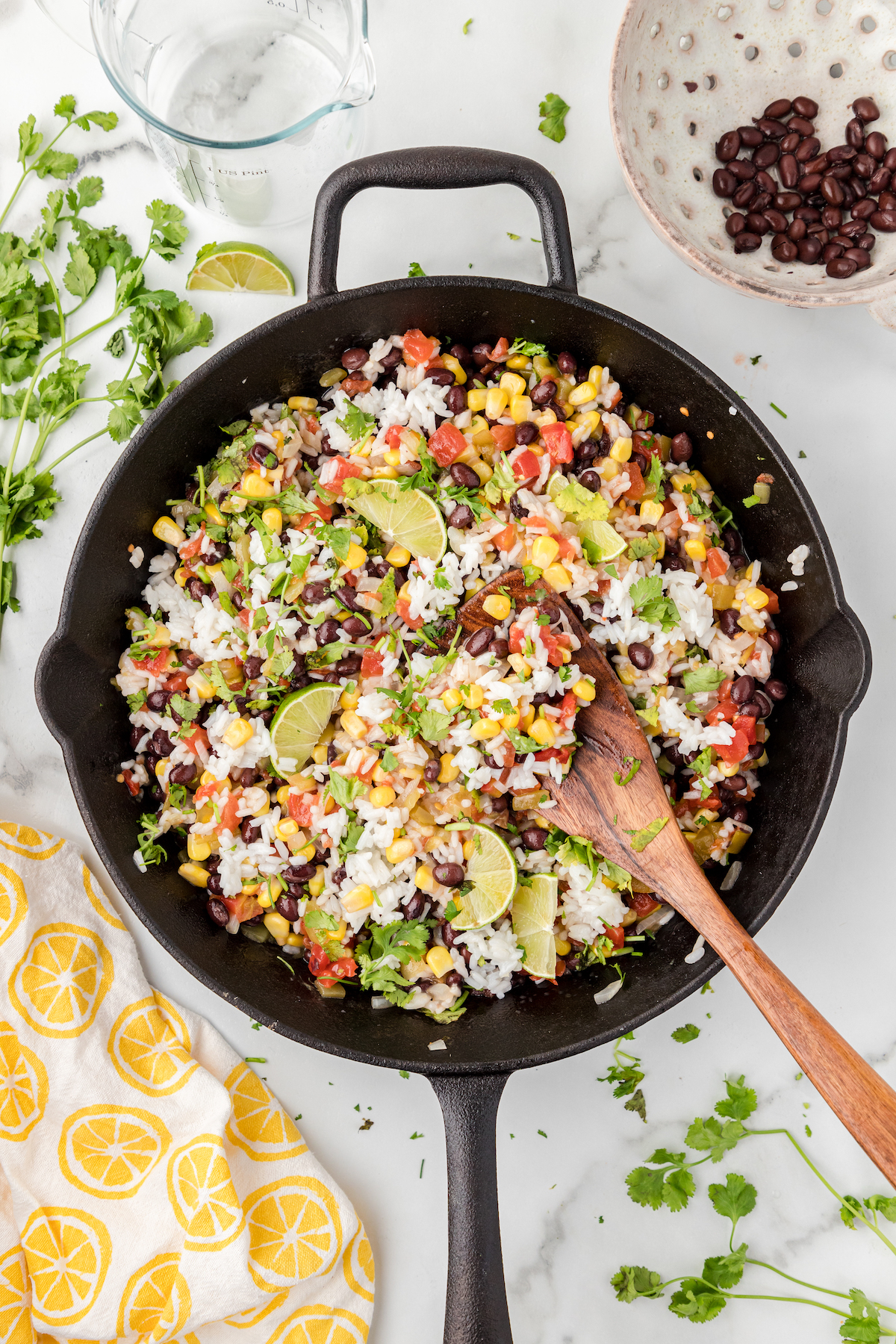 cilantro lime rice with black beans in a cast iron skillet