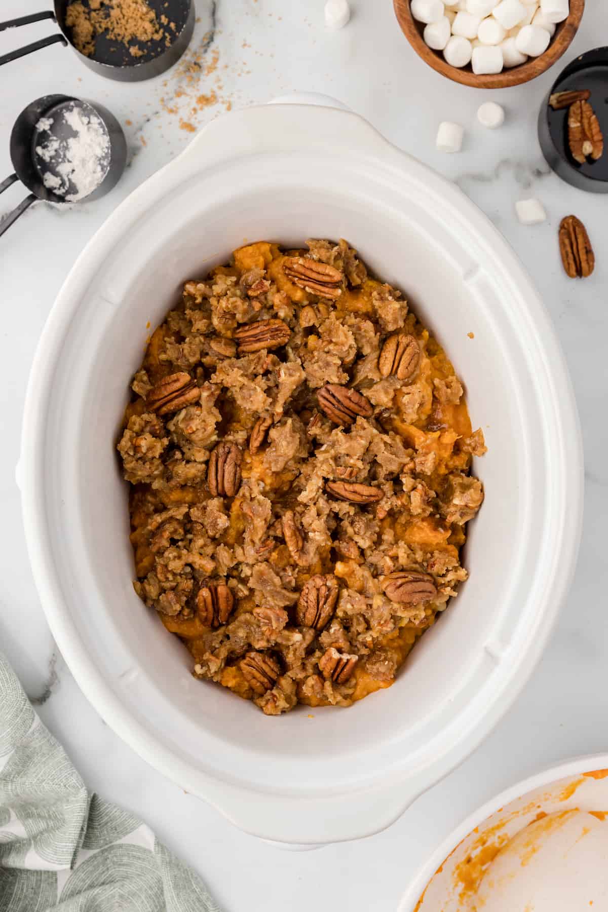 crockpot sweet potato casserole with pecan topping added