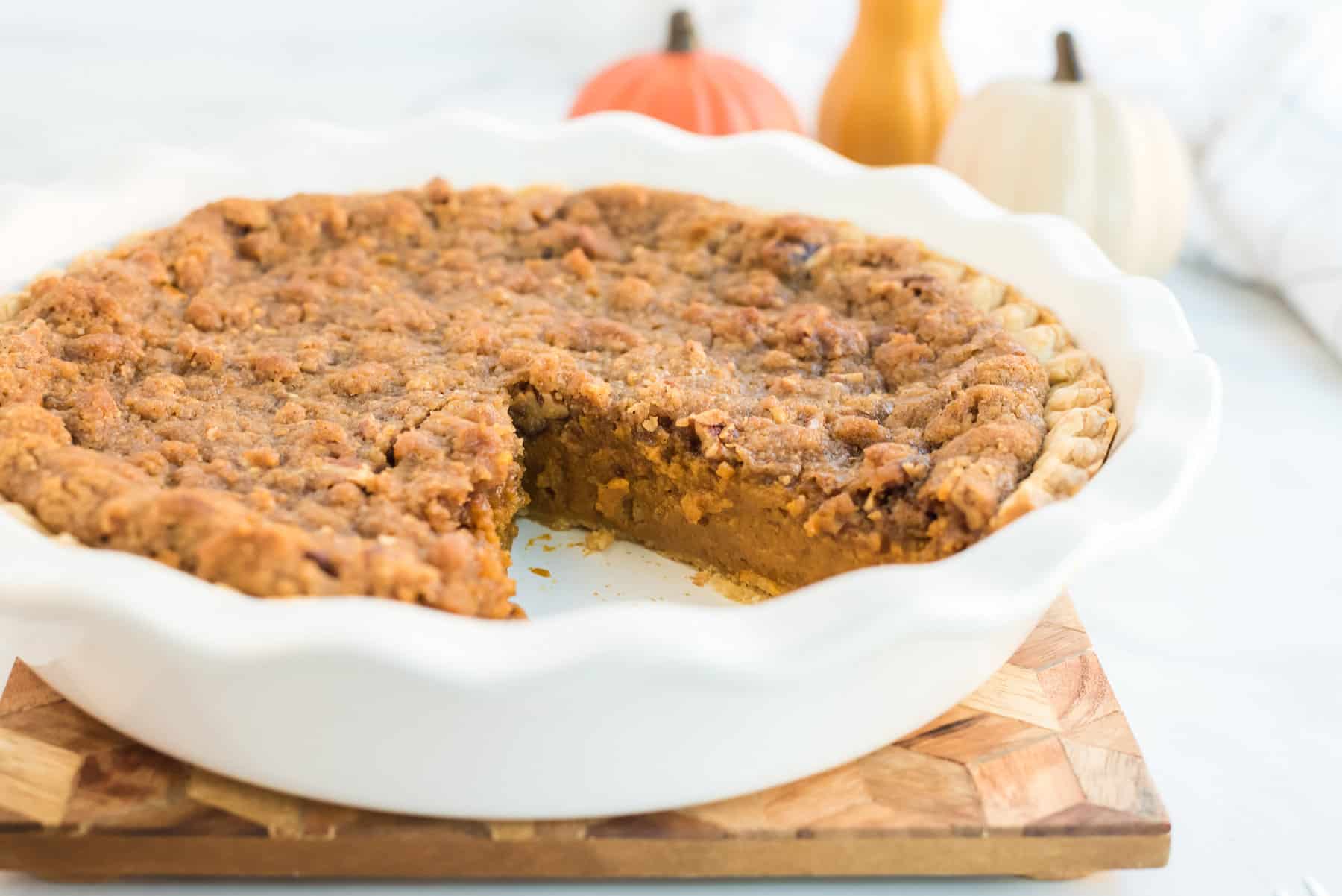 a side view of a praline pumpkin pie