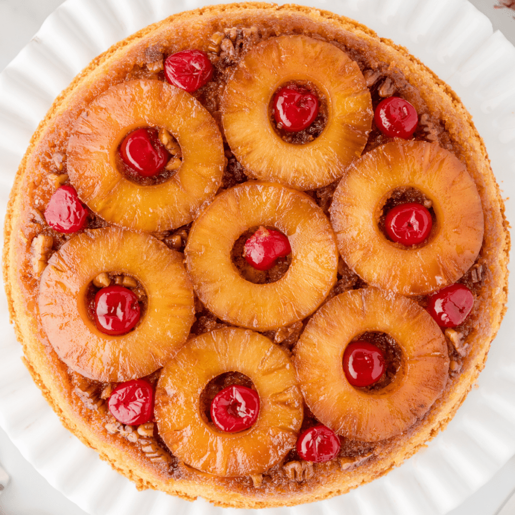 pineapple upside down cake with pecans and maraschino cherriesmade in a skillet