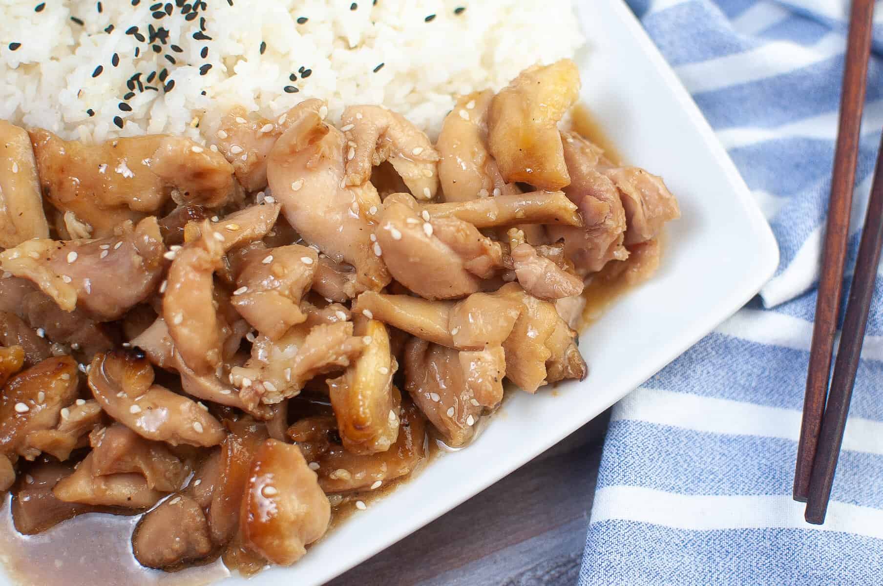 air fryer teriyaki chicken thighs on a white plate with white rice