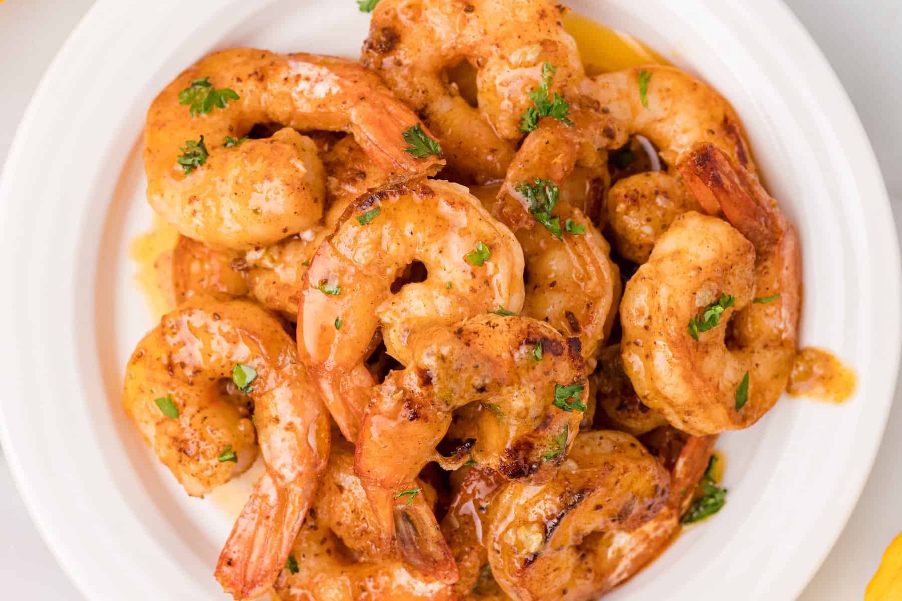 a plate of lemon garlic butter shrimp