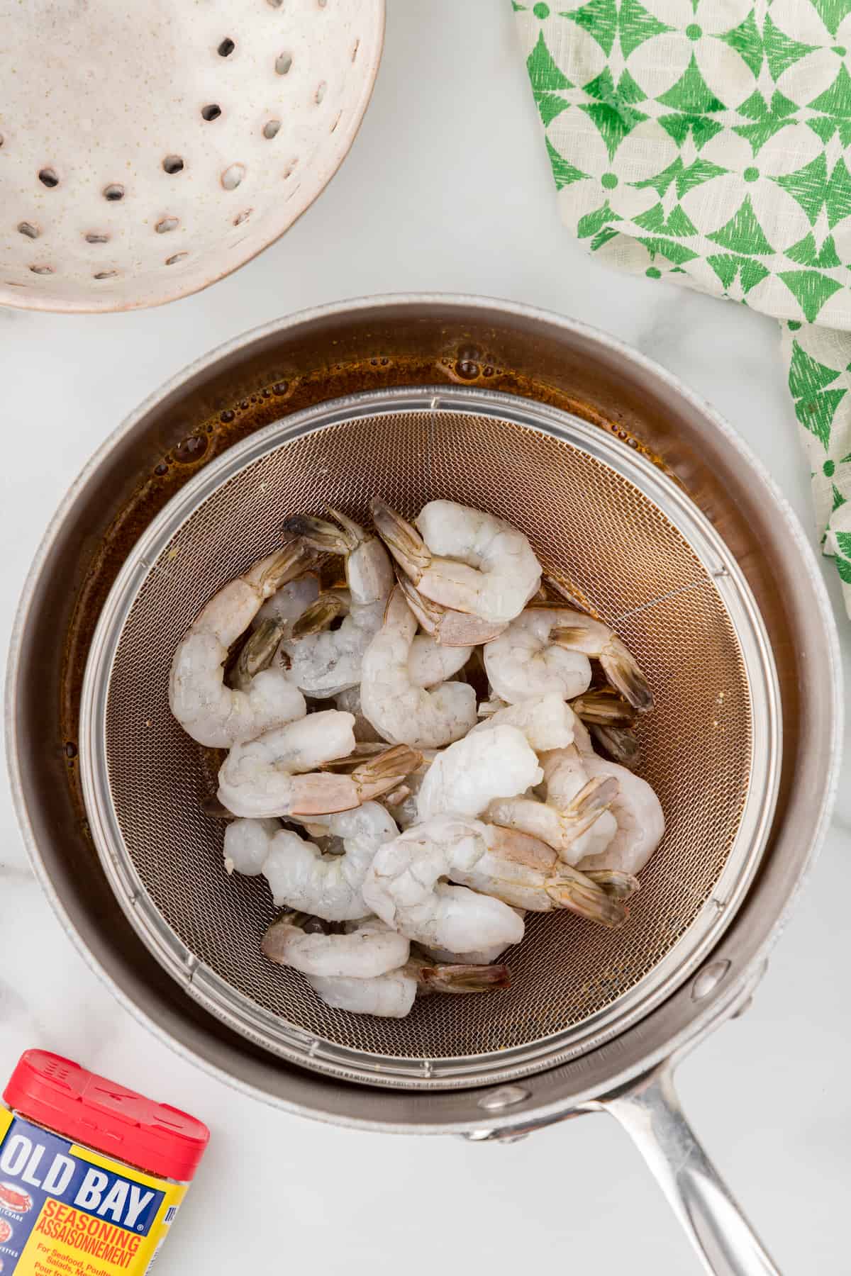 add the raw shrimp to a steamer basket above the water