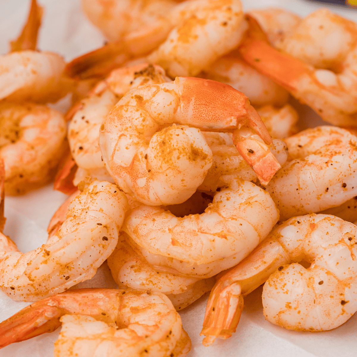 peel and eat shrimp on a white plate