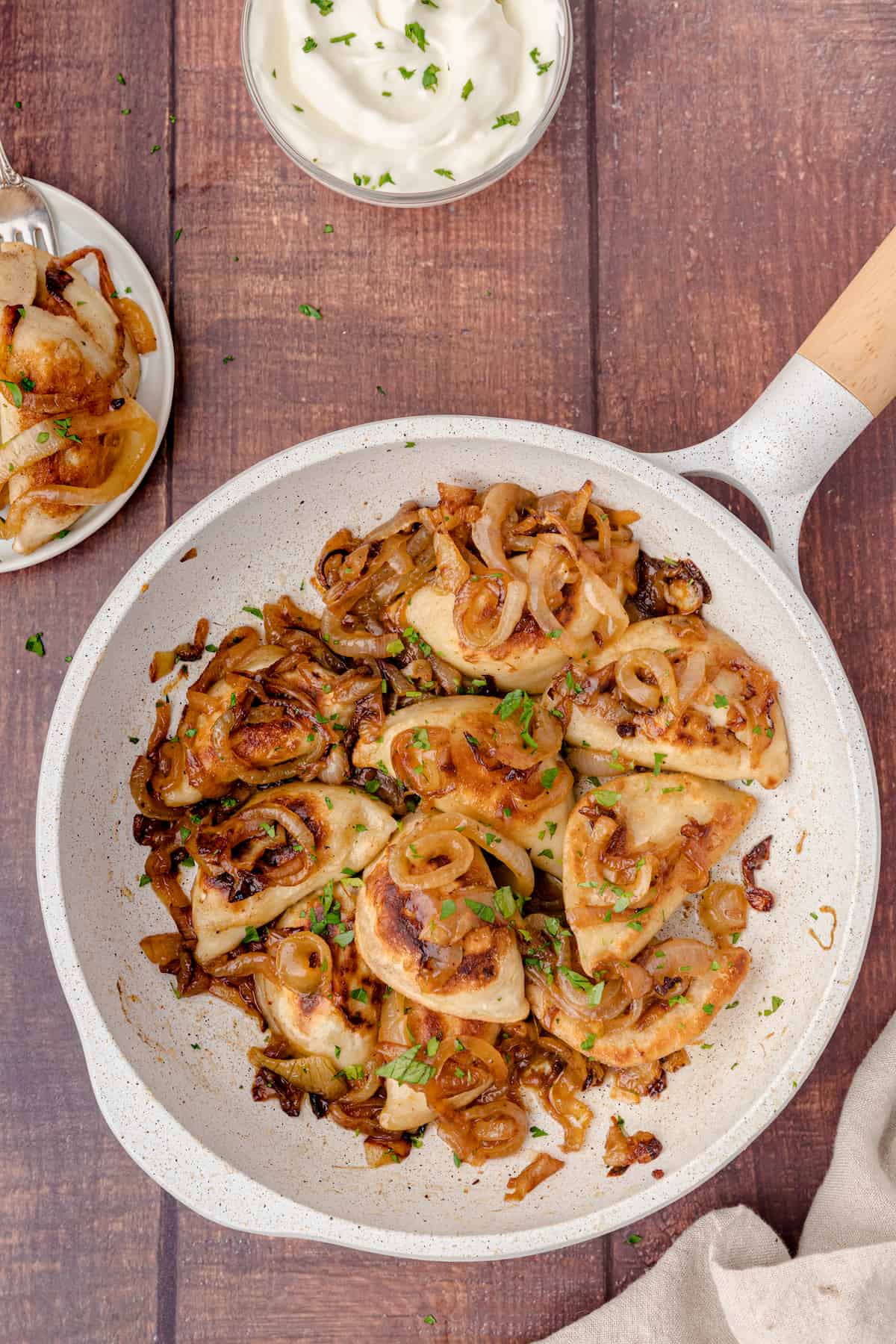 add the pierogies to the onions in the skillet