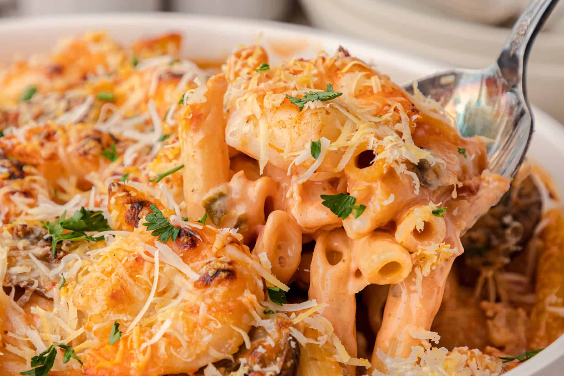 a close up of cheesy shrimp pasta bake