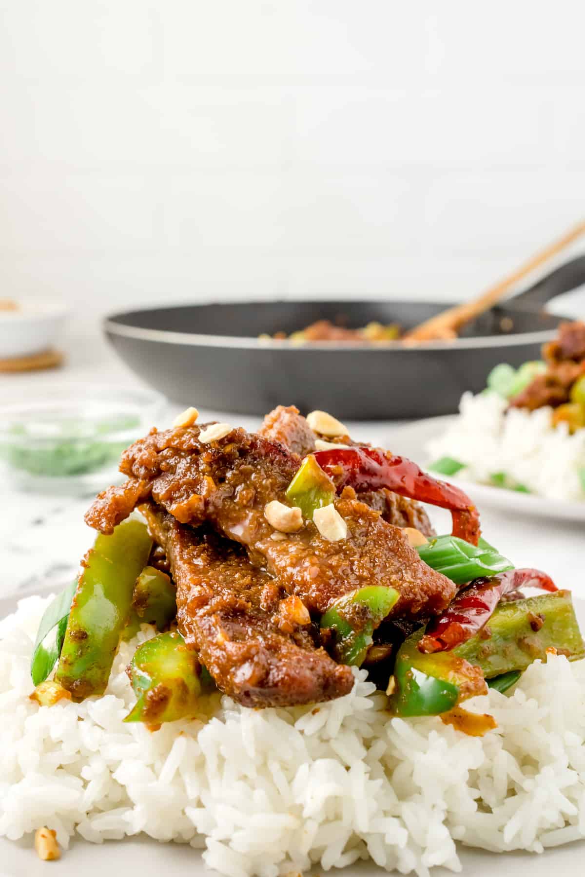 one serving of Kung Pao Beef on a bed of rice