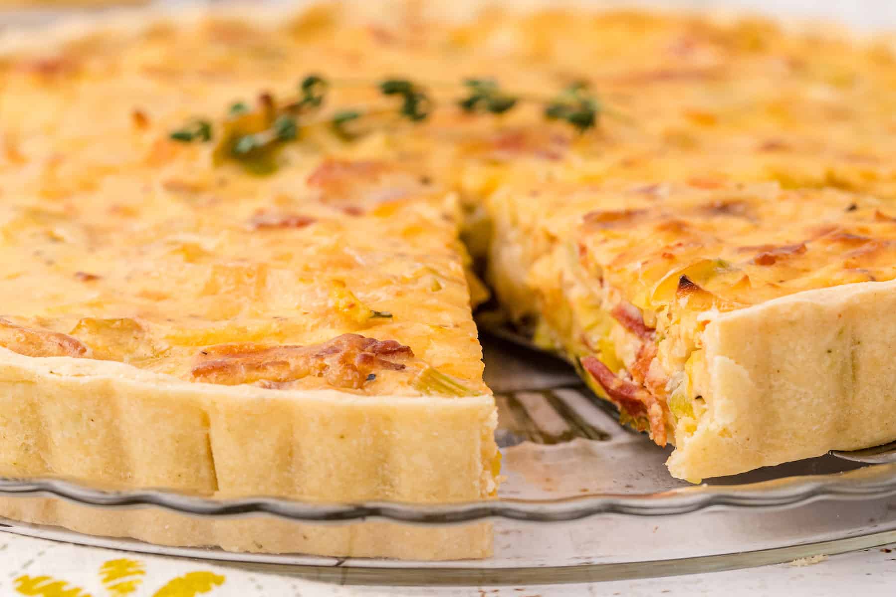 bacon leek tart with onions with one slice removed
