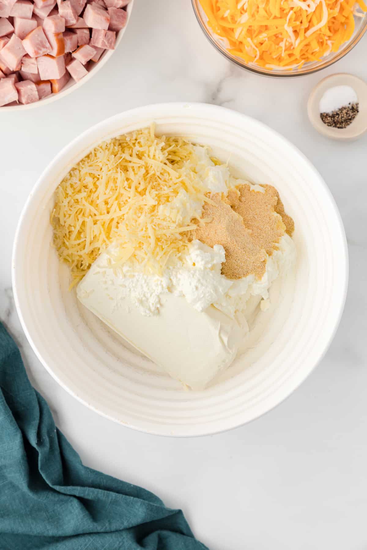 mix the cream cheese, spices, and Parmesan in a small bowl