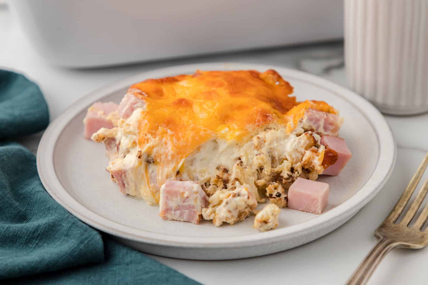 one serving of cheesy ham casserole with cauliflower