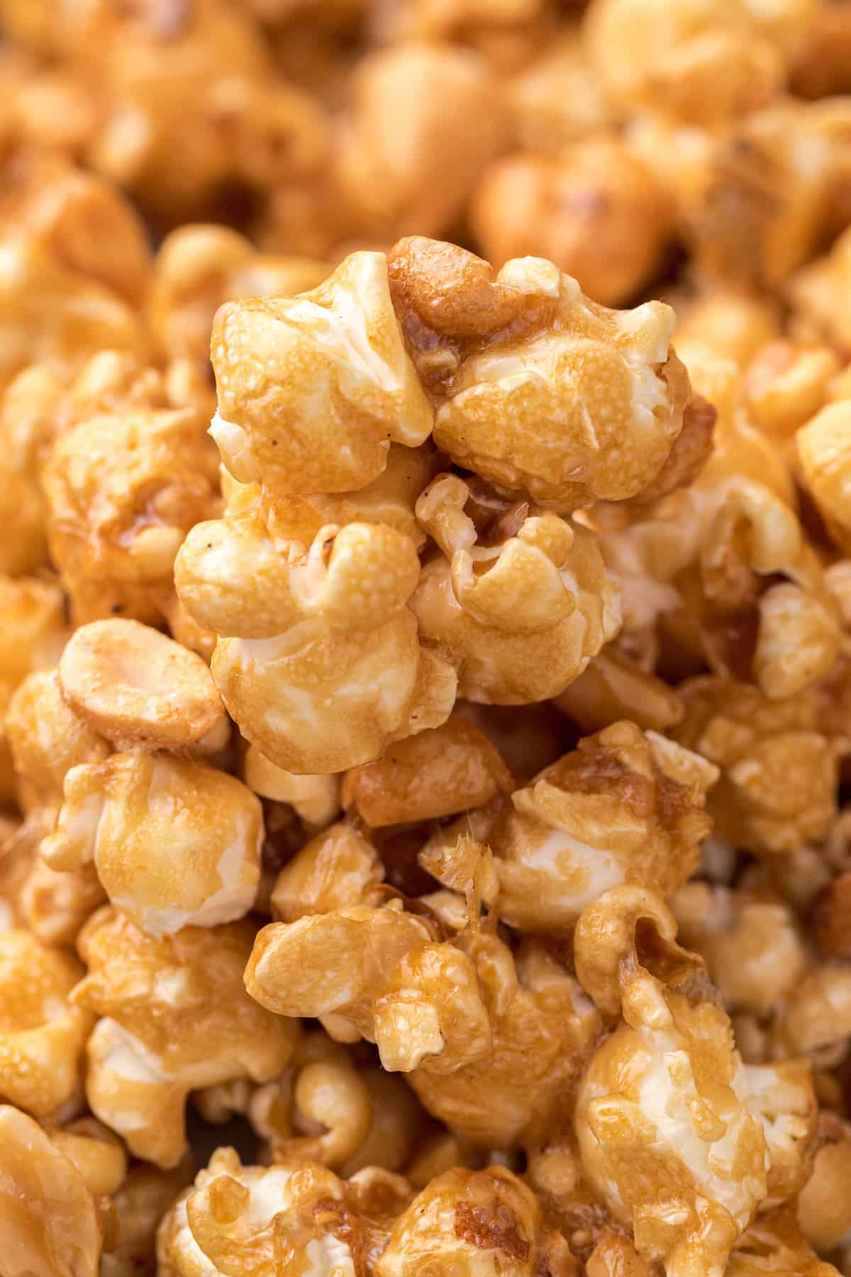 a close up of homemade caramel popcorn with peanuts