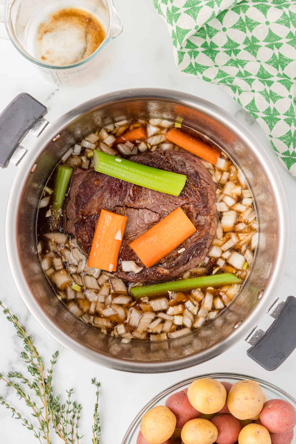 Add celery to the chuck roast in the Instant Pot