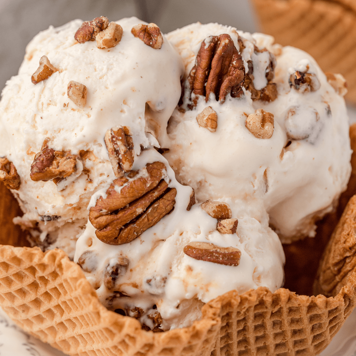 no churn butter pecan ice cream in a waffle bowl