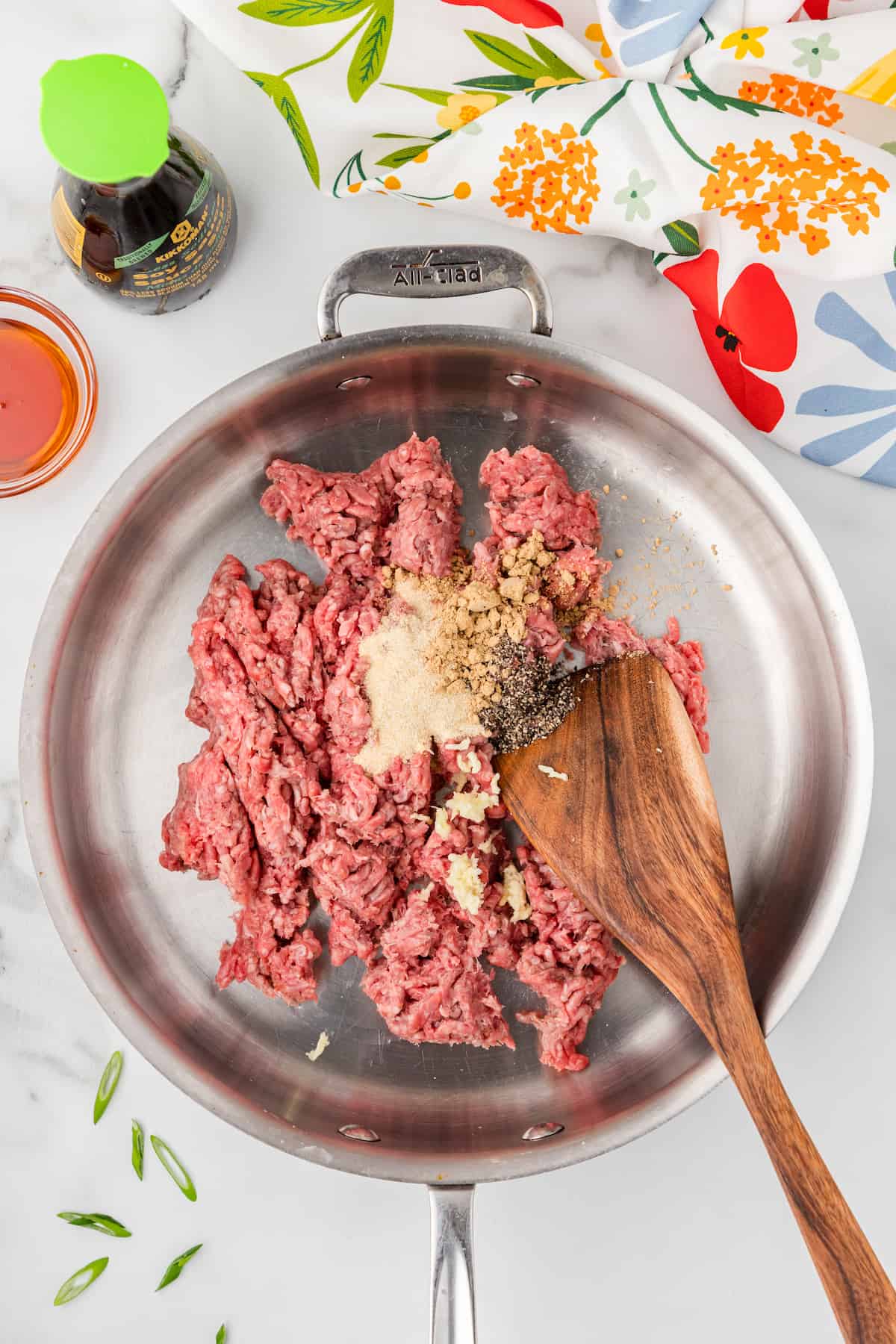 ground beef with spices in a skillet