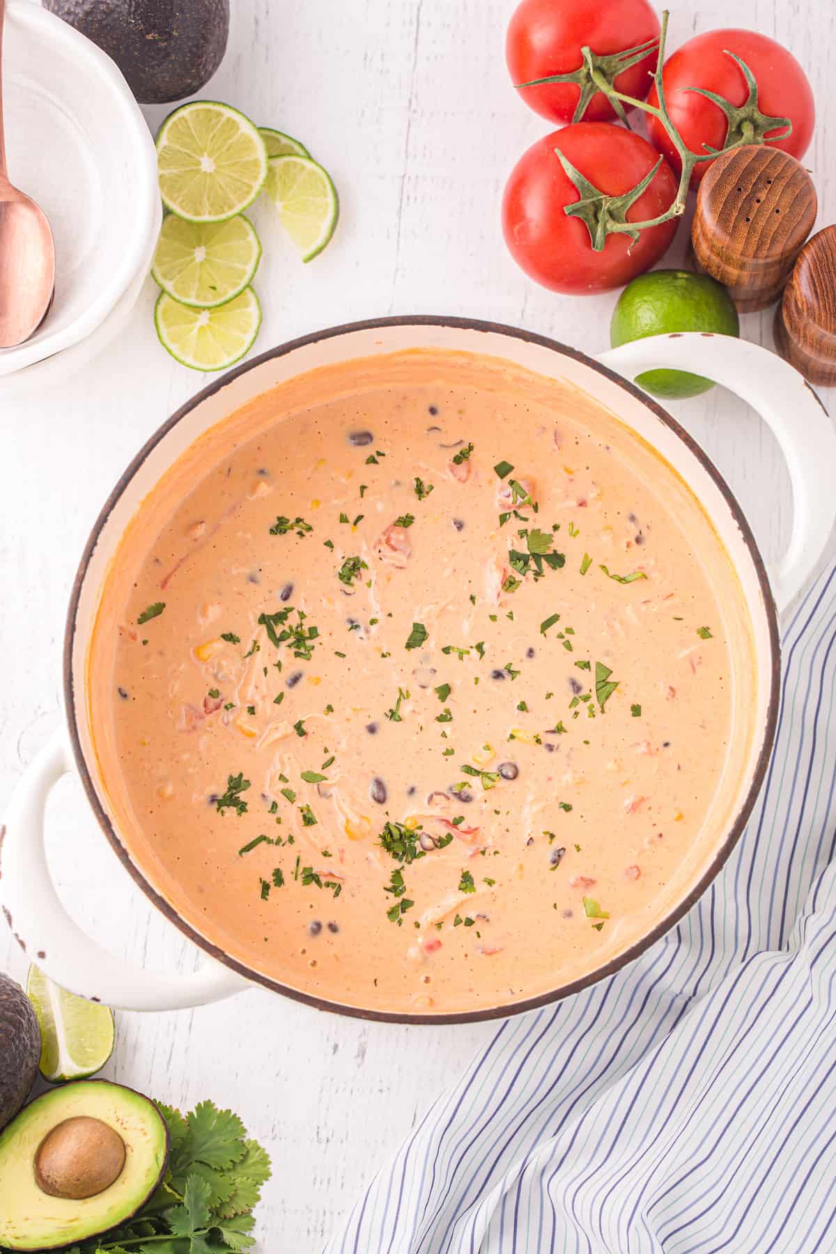 creamy chicken enchilada soup in a white pot