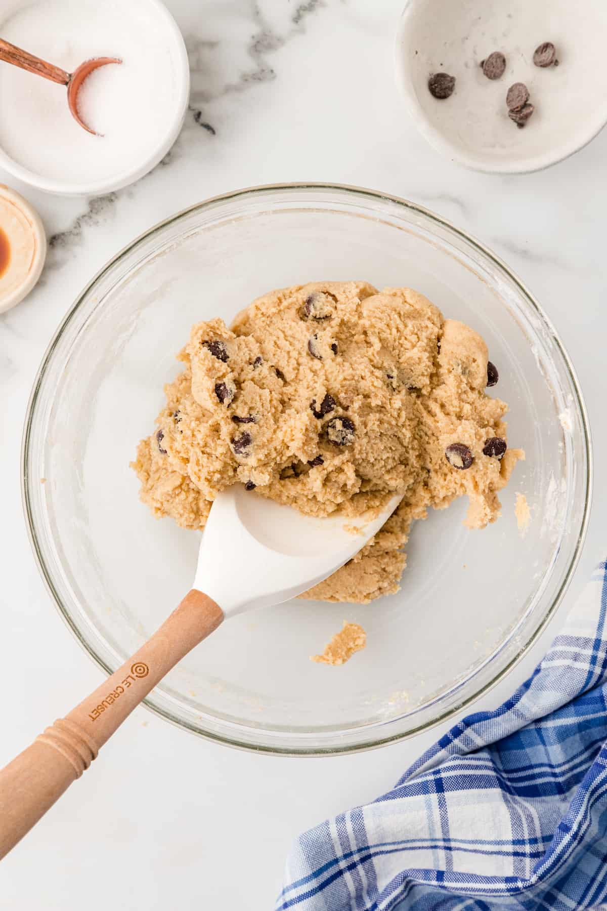 chocolate chip cookie dough with a rubber spatula