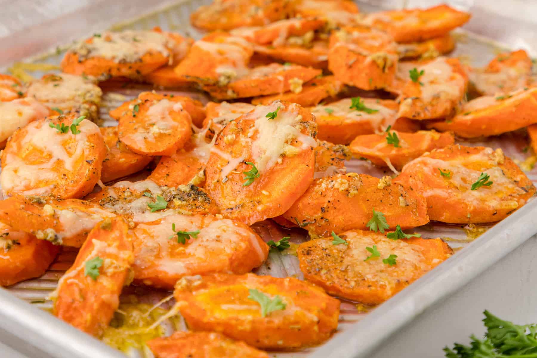 garlic parmesan roasted carrots on a sheet pan