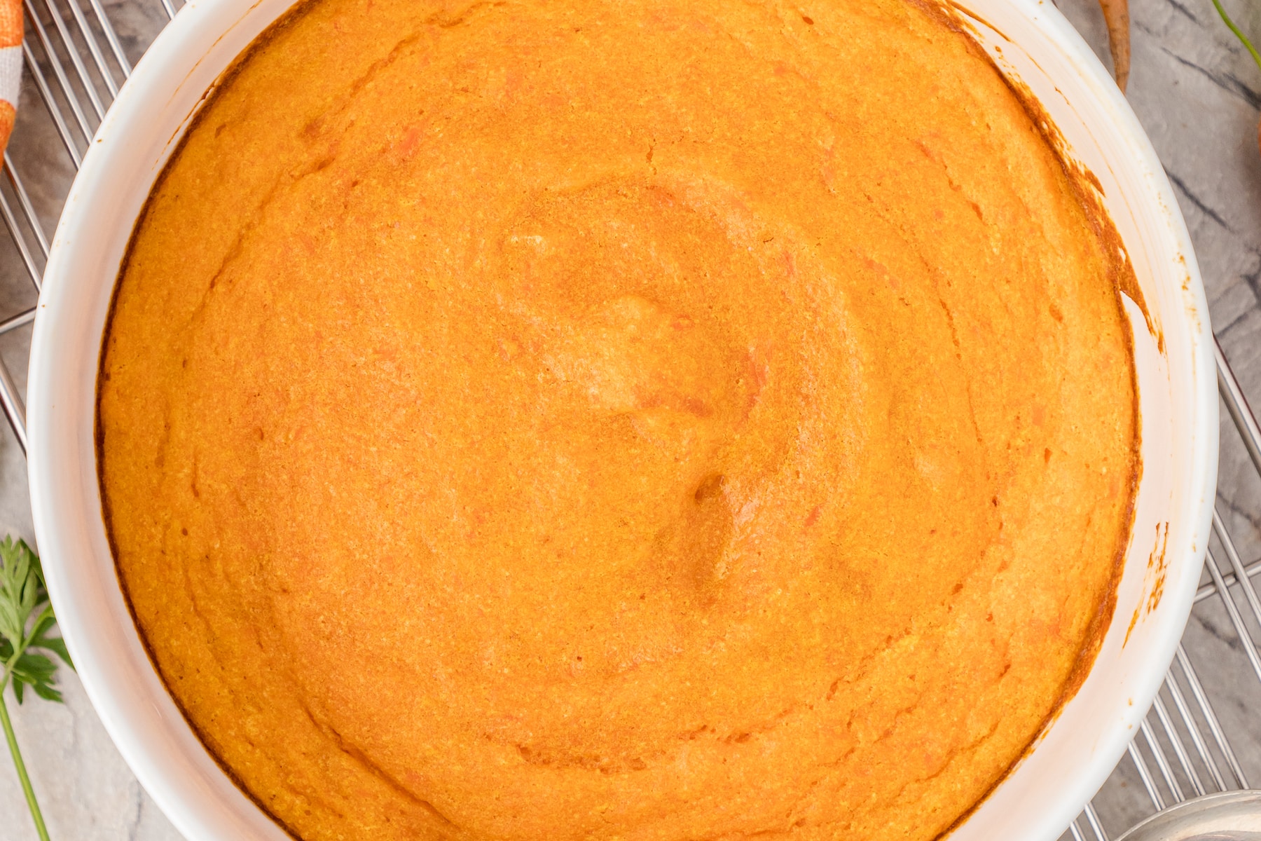 carrot souffle in a white baking dish
