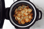 a close up of potato chips in the air fryer