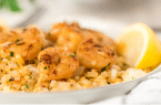 a close up of shrimp over cauliflower rice