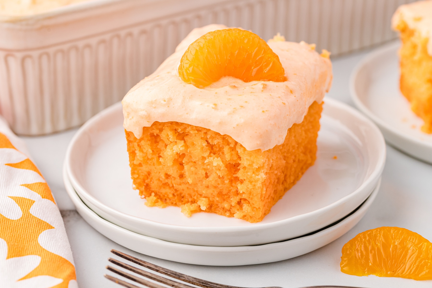 Orange Creamsicle Cake on a white plate