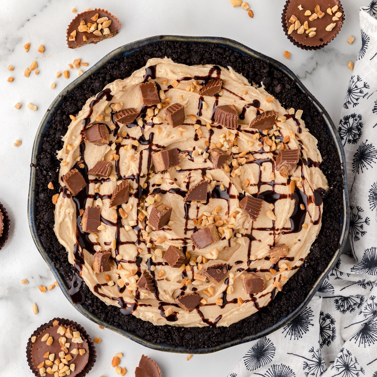 no bake peanut butter pie topped with chopped peanut butter cups