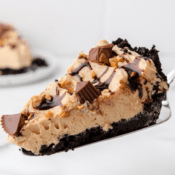one slice of no bake peanut butter pie with a chocolate crust