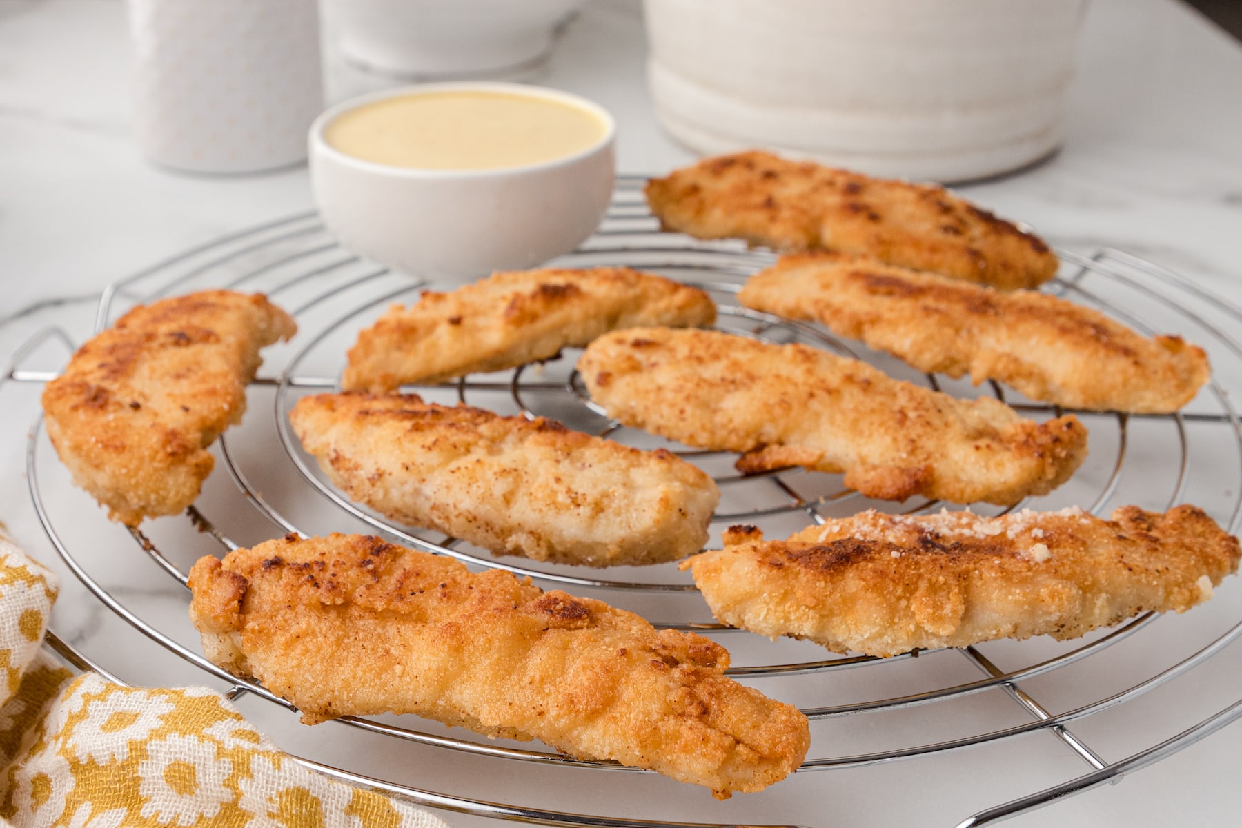 nut crusted chicken tenders on a cooling rack