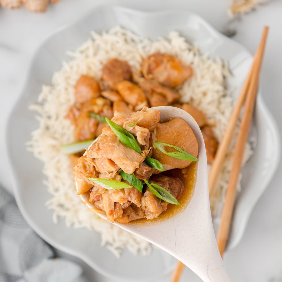 Instant Pot Mongolian Chicken on a white spoon