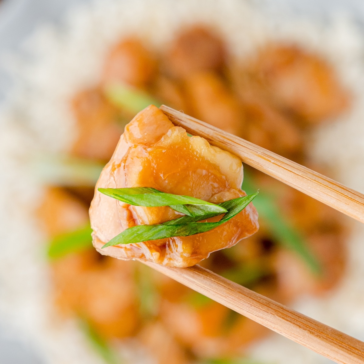 one bit of Instant Pot PF Chang's Mongolian Chicken in chopsticks