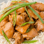 a close up of Instant Pot PF Chang's mongolian chicken topped with green onions