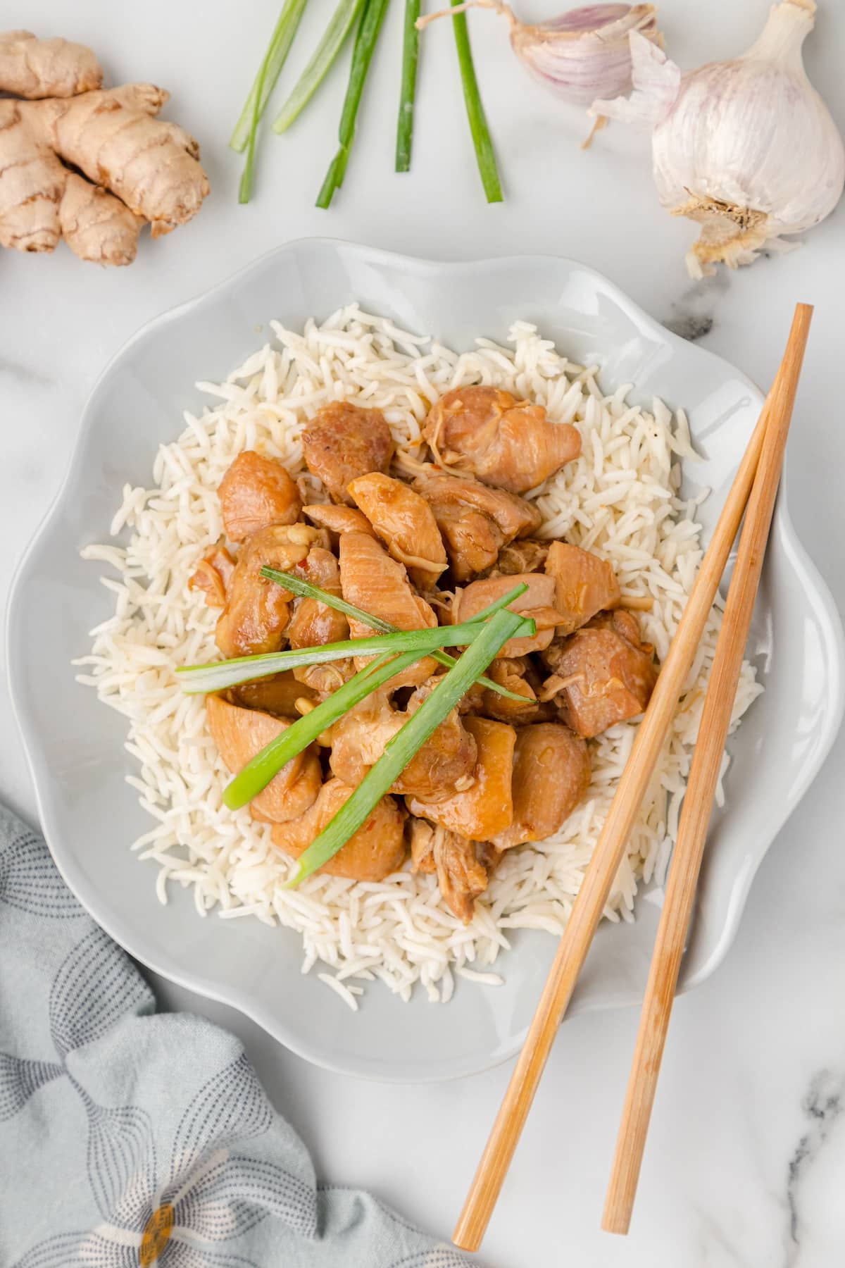 one serving of Instant Pot PF Chang's Mongolian Chicken on a bed of rice with chopsticks