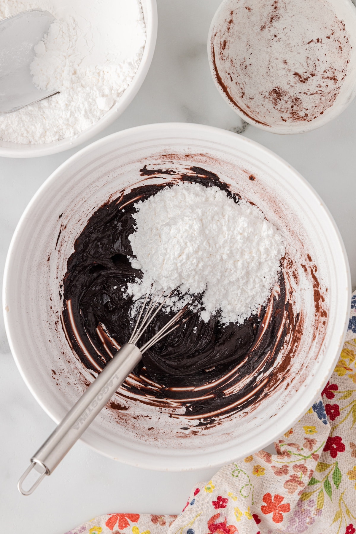 add powdered sugar to the chocolate frosting